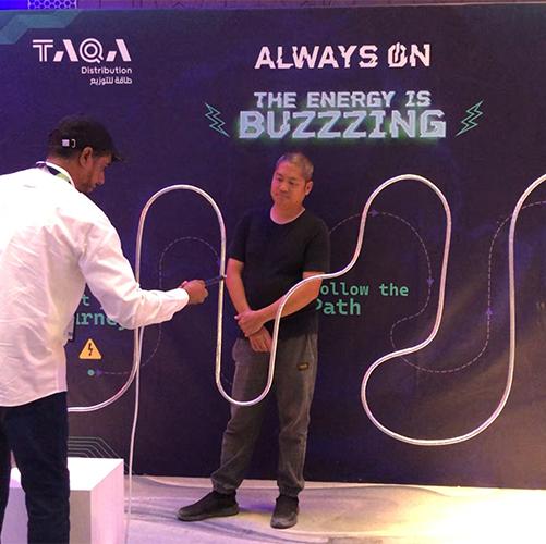 Giant Buzz Wire rental in Dubai with custom branding and wire shape for corporate events, brand activations, and carnival games in the UAE